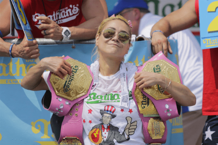 Miki Sudo with her championship belts